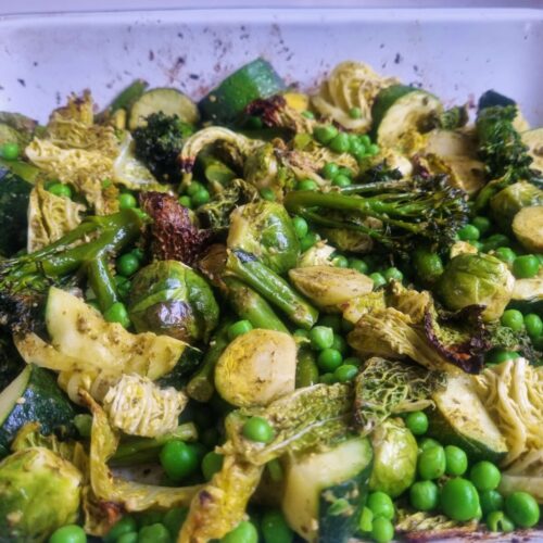 closeup of a tray of pesto roasted green vegetables