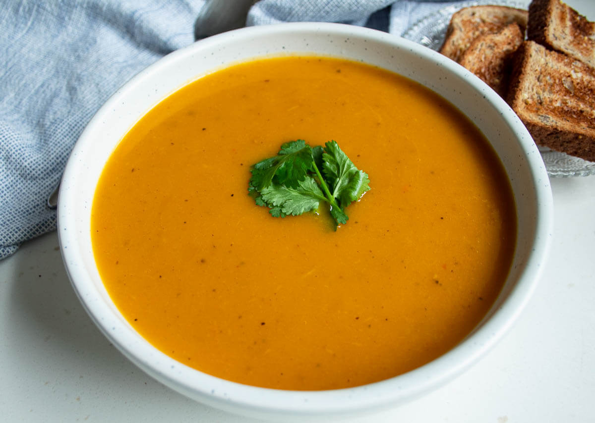 bowl of cajun spiced squash soup and bread