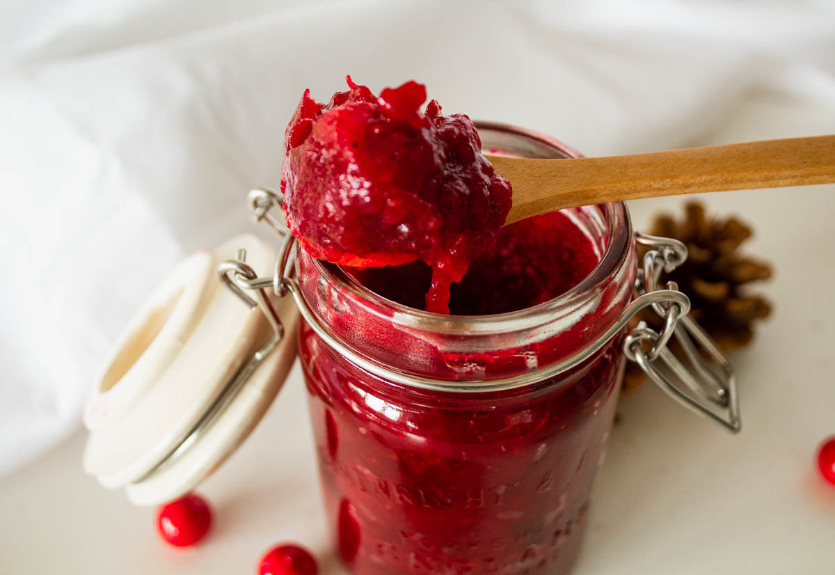 homemade sugar free cranberry sauce on a spoon