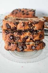 3 slices of chocolate chip banana bread stacked on a plate
