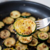closeup of zesty pan fried courgettes on a fork