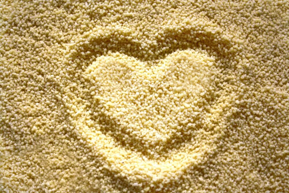 a pile of couscous with a heart drawn in it