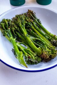 oven roasted long stem broccoli in a serving dish