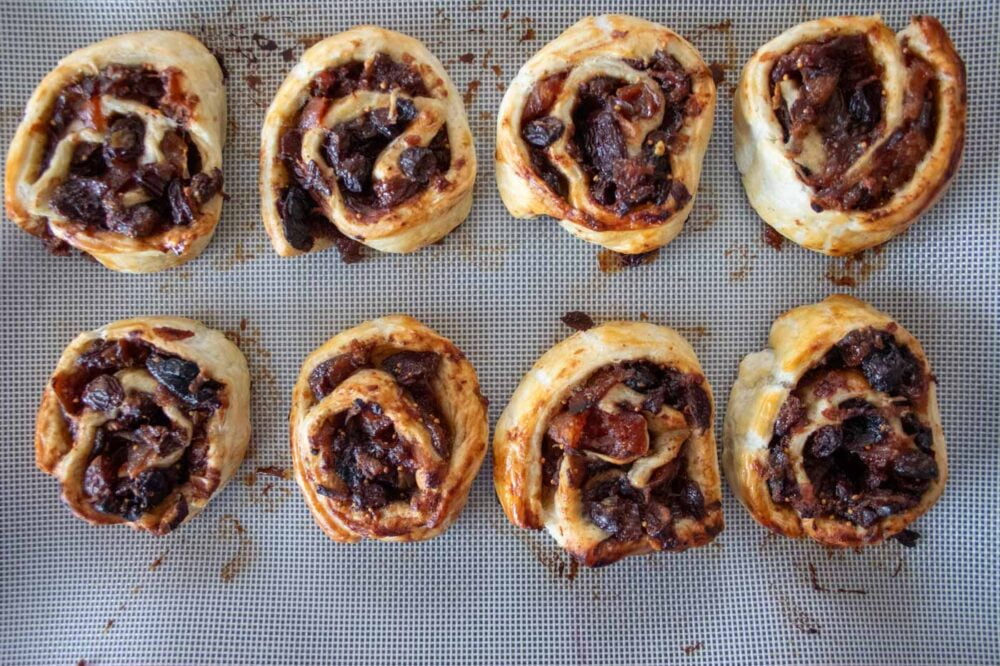 cooked mincemeat pinwheels on a baking tray
