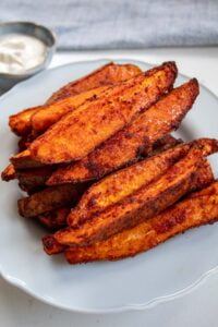 smoked paprika sweet potatoes stacked on a plate