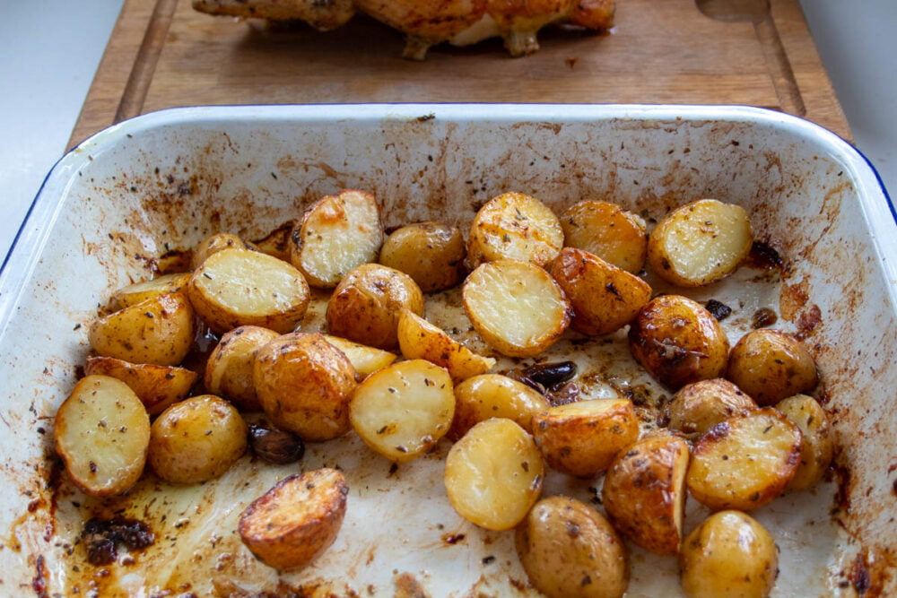 garlicky roast potatoes in a roasting tray