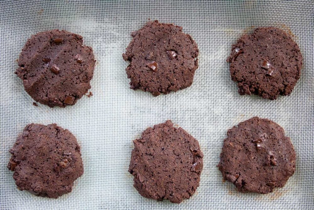 almond chocolate cookies cooling on the baking tray