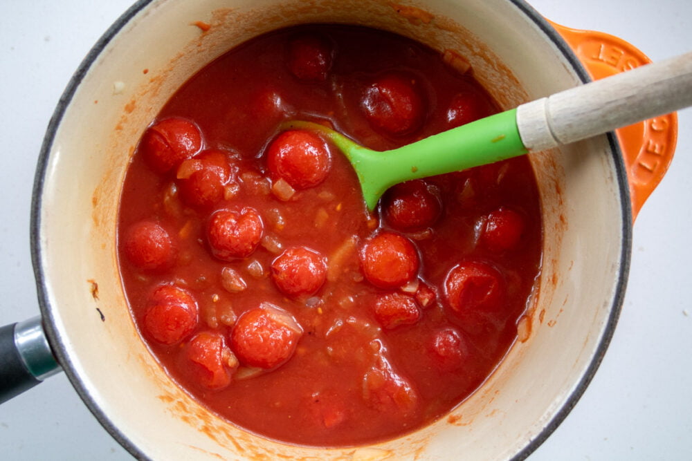 tinned cherry tomatoes in a saucepan