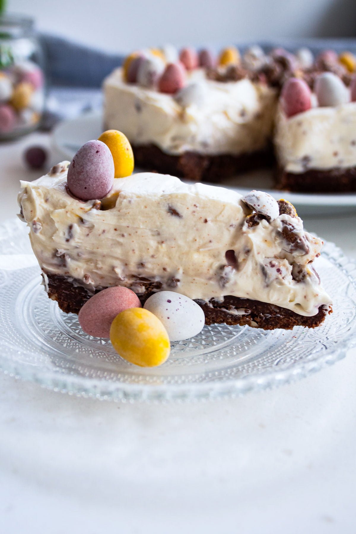 a slice of easter cheesecake with mini eggs