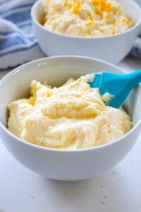 diabetic cream cheese frosting in2 bowls with a spatula