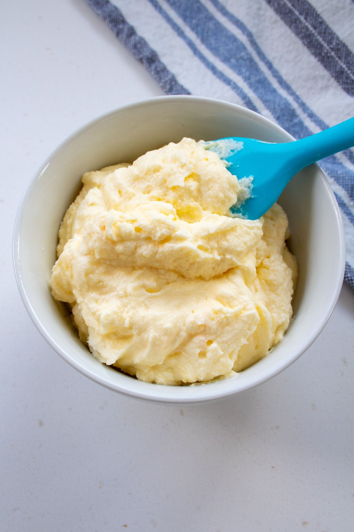 sugar free cream cheese frosting in a bowl with a spatula
