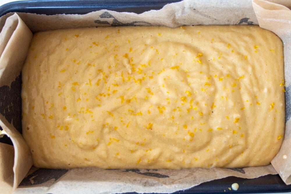 uncooked sugar free lemon drizzle cake in a loaf tin