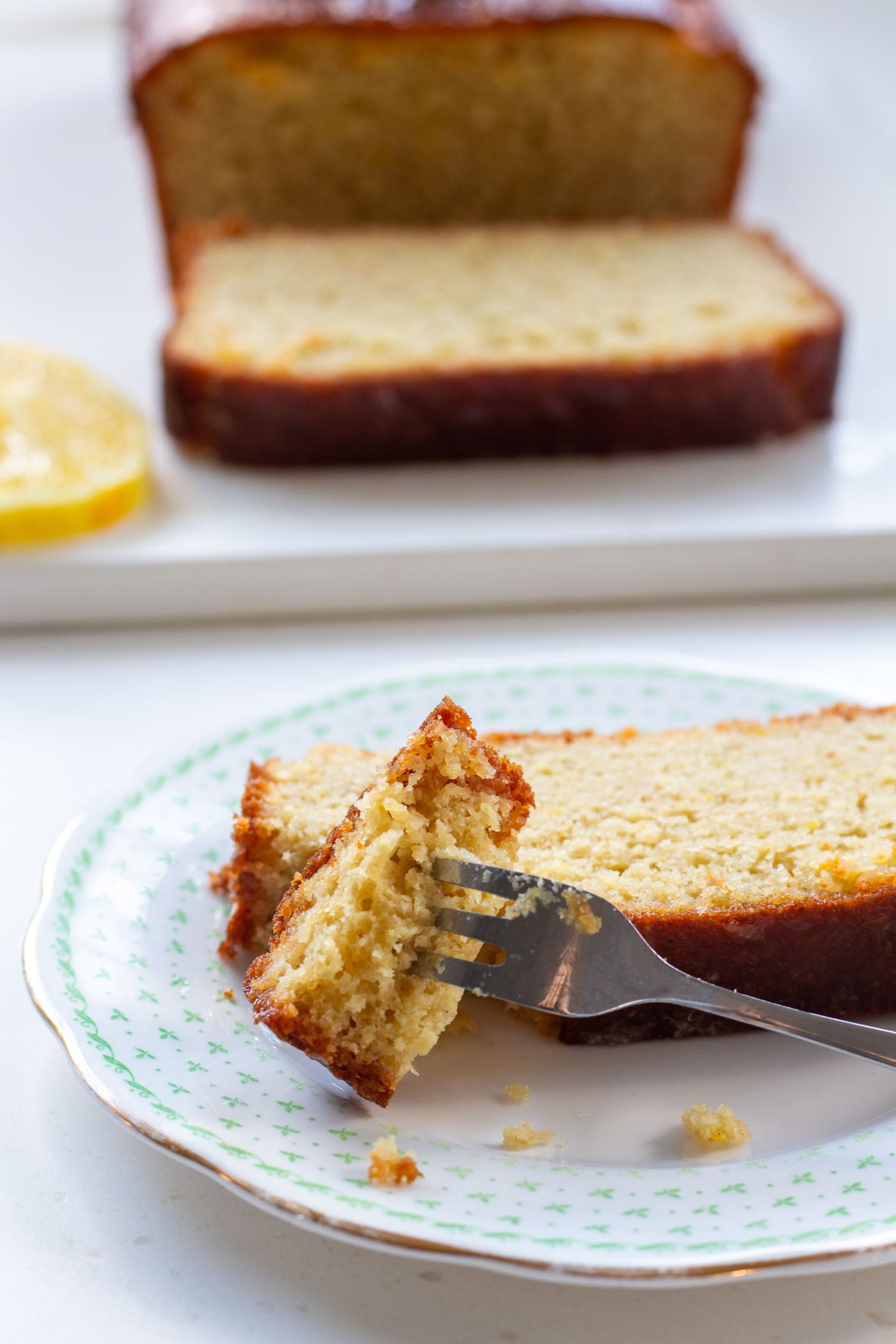 a piece of sugar free lemon drizzle cake on a fork