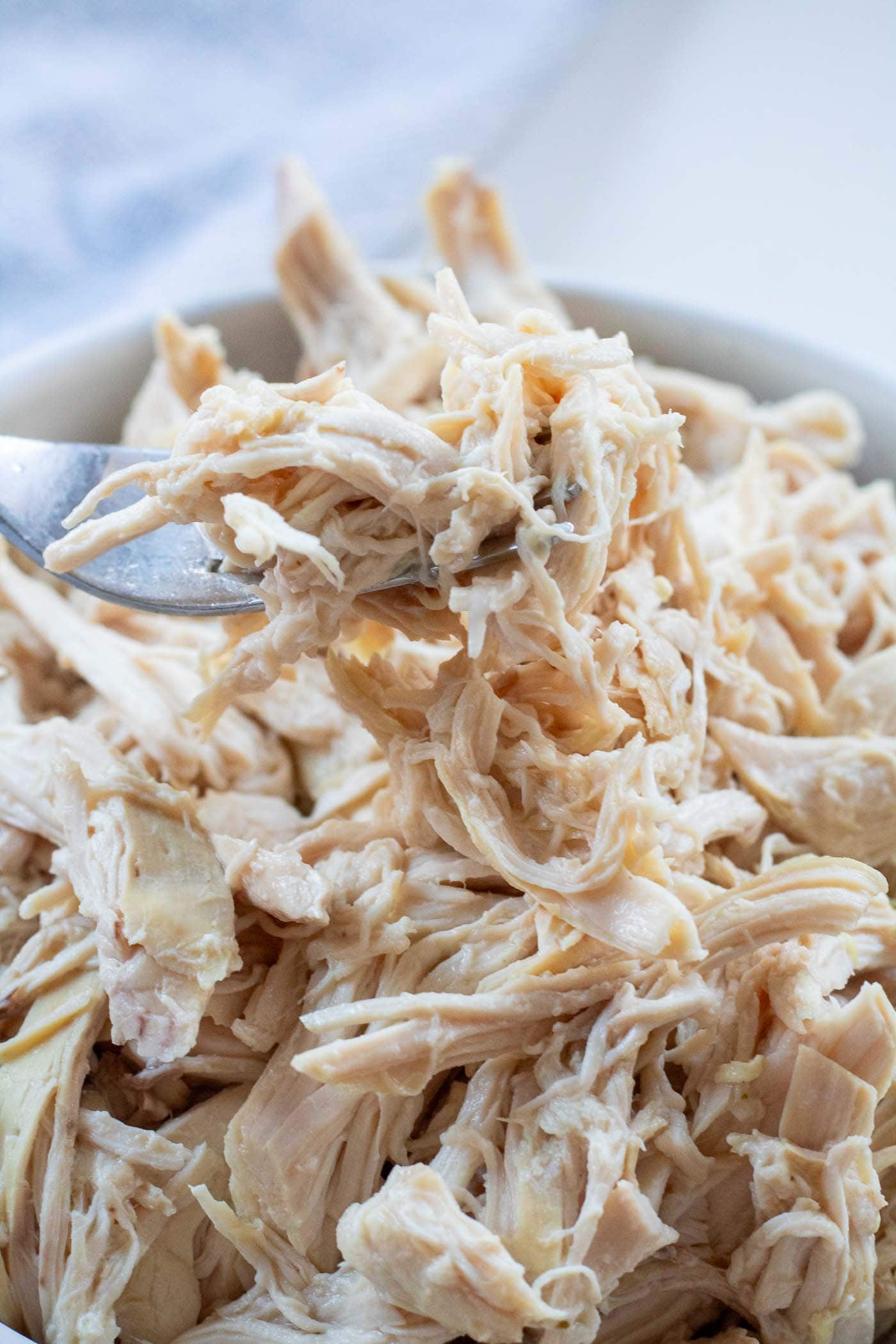 Juicy shredded chicken being scooped and ready for salads, wraps or balanced diabetes-friendly dinners